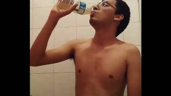 Amateur boy drinks his piss